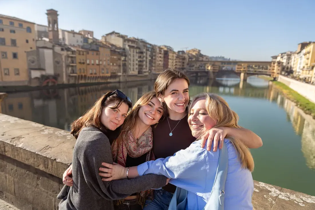 Group of friends hugging.